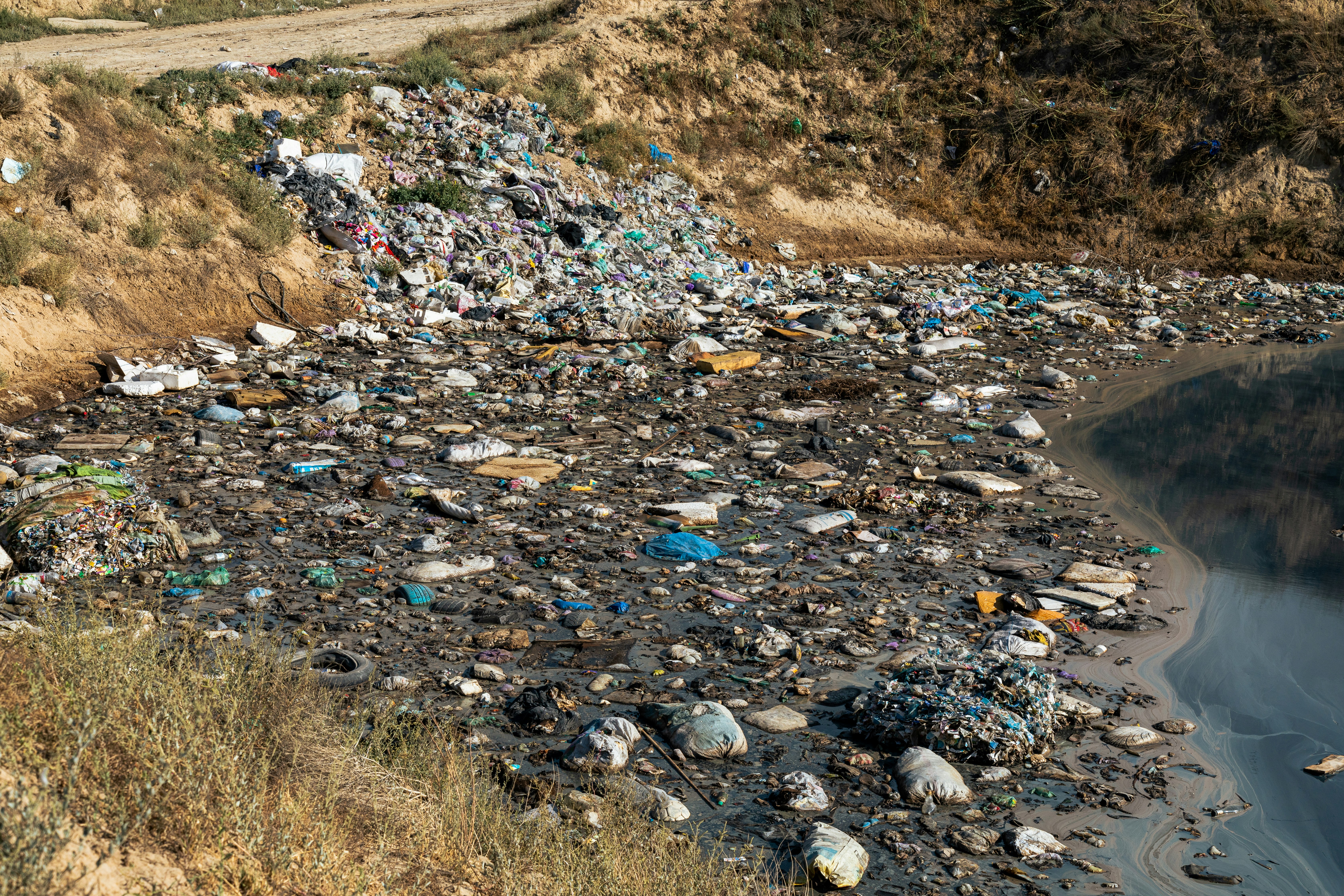 Waste and rubbish polluting a river.